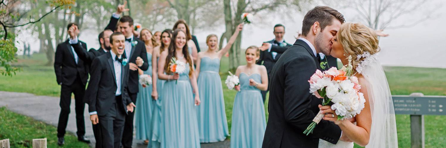 Peaks of Otter wedding guests cheer during bride and groom