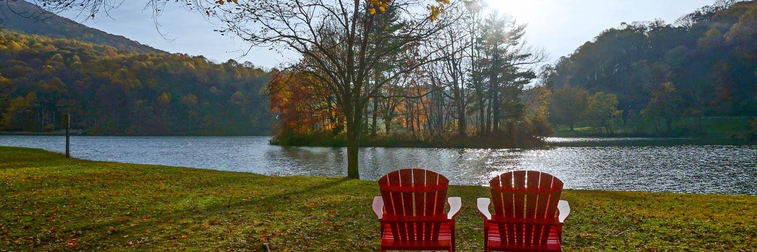 Two chairs with a view of Abbott Lake at Peaks of Otter Lodge