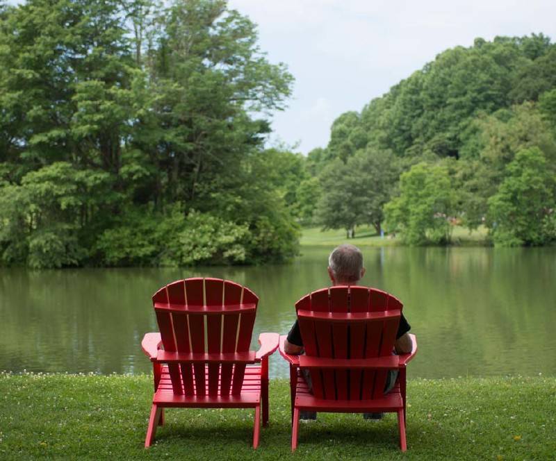 Guest Sitting in Lakeside Chair
